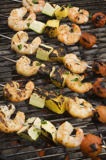 Shish kebab cooking on grill.