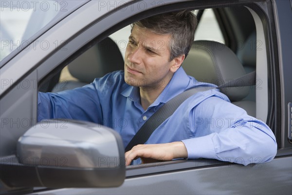 Man driving car.