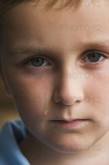 Close up of boy crying.
