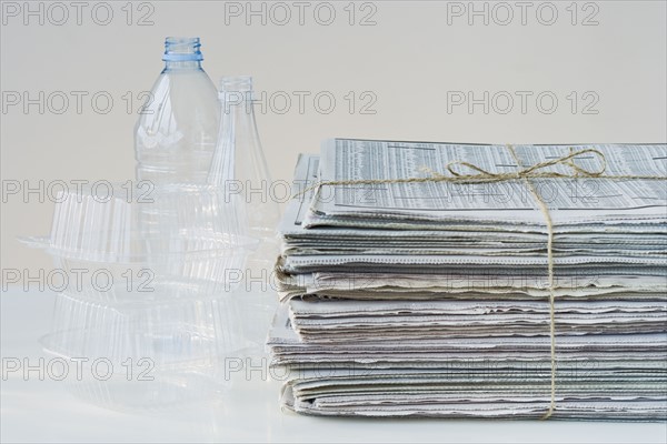 Bundled newspapers and plastic for recycling.