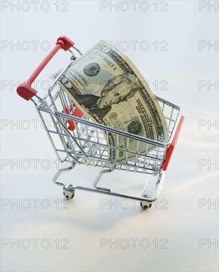 Twenty Dollar bill in shopping cart.
