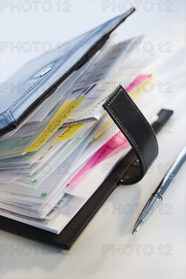 Close up of datebook and pen.