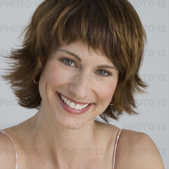 Close up of woman smiling.