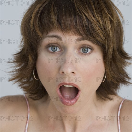 Close up of woman looking surprised.