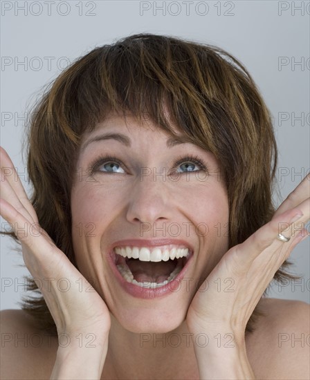 Close up of woman laughing.