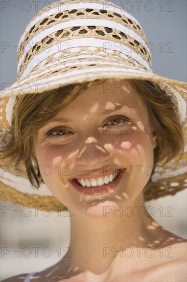 Woman wearing sunhat.