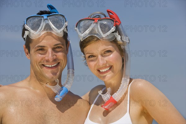 Couple wearing snorkeling gear.
