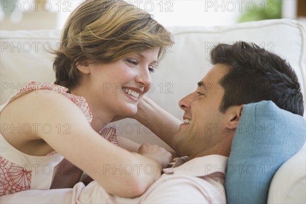 Couple smiling at each other.