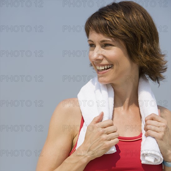 Woman with towel around neck.