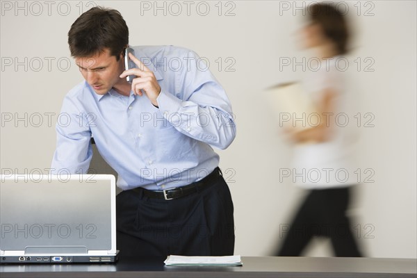 Businessman talking on cell phone.