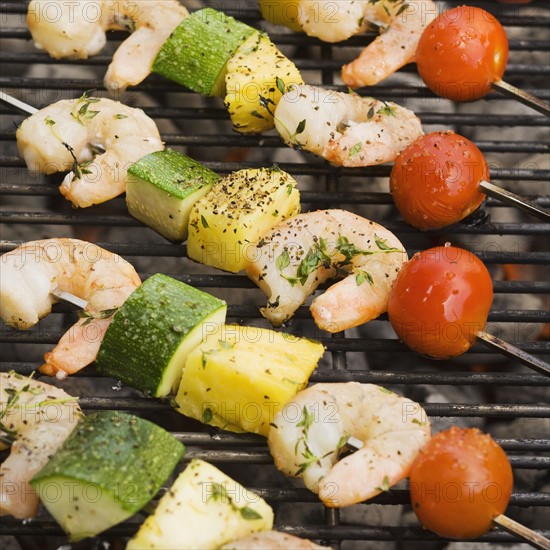 Shish kebab cooking on grill.