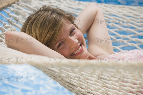 Woman laying in hammock.