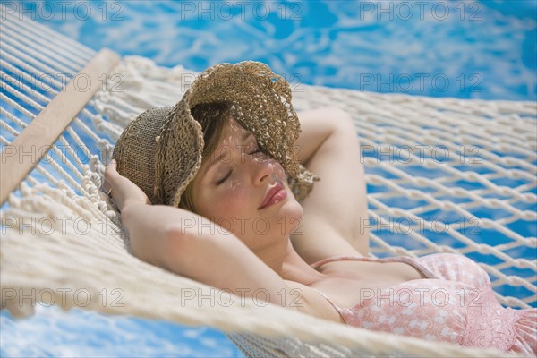 Woman laying in hammock.
