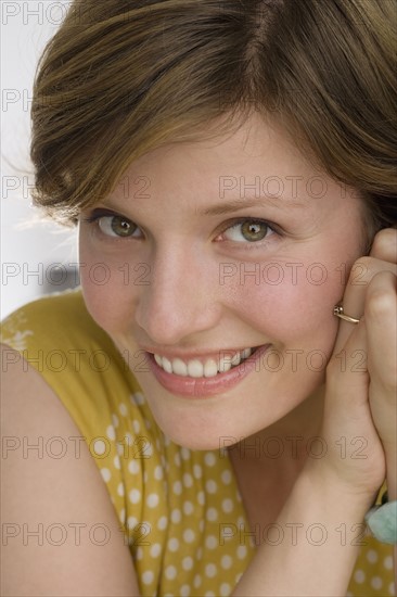 Close up of woman smiling.