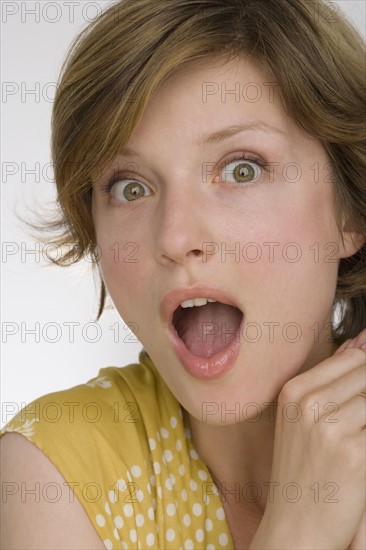 Close up of woman looking surprised.