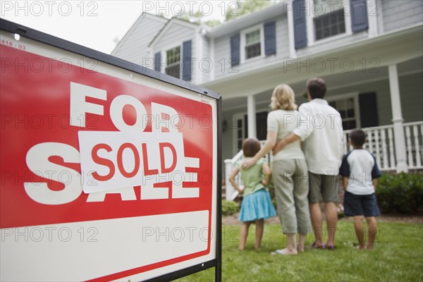 Family looking at new house.