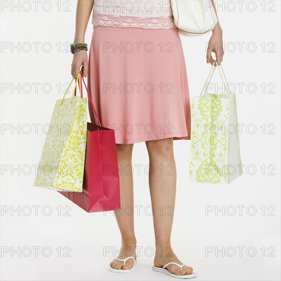 Woman holding shopping bags.