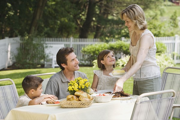 Family eating outdoors.