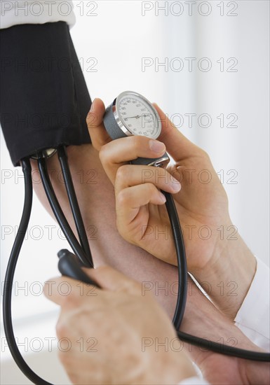Person having blood pressure measured.