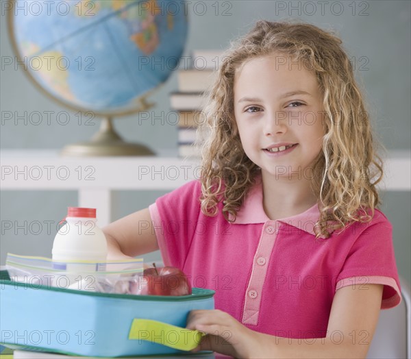 Girl eating lunch at school.