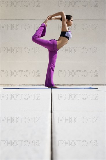 Woman practicing yoga.