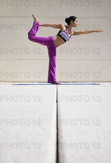 Woman practicing yoga.