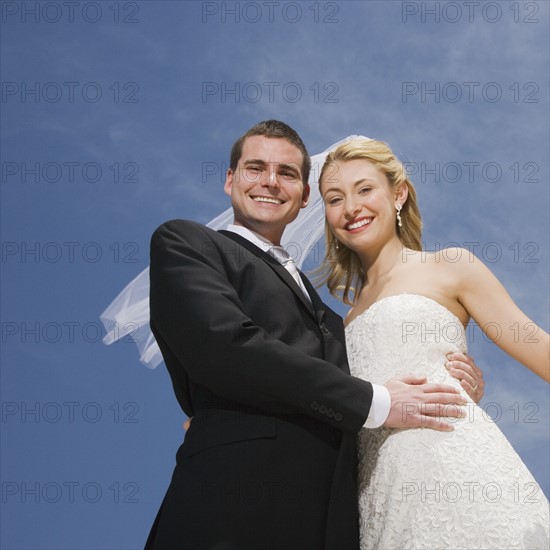 Low angle view of bride and groom.