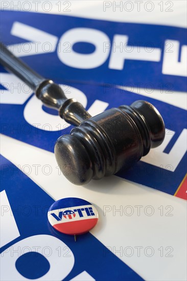 Judge’s gavel on vote signs.