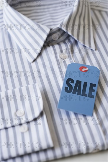 Sale tag on men’s shirt.