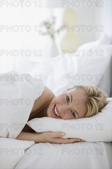 Woman laying in bed.