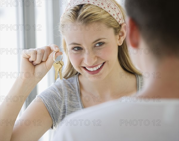 Woman holding house keys.