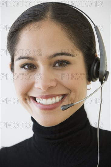 Businesswoman wearing headset.