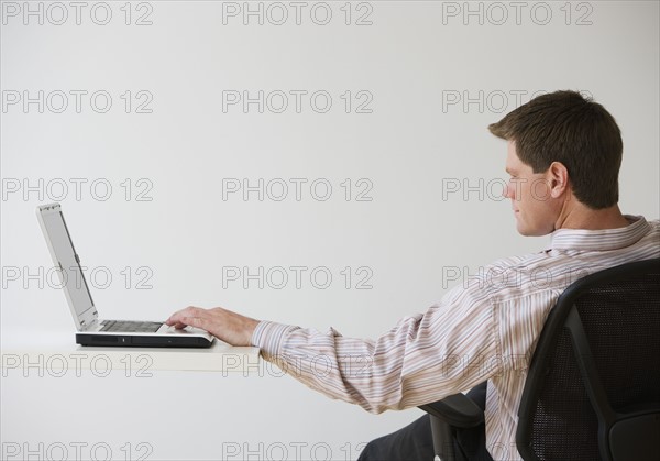 Businessman using laptop.