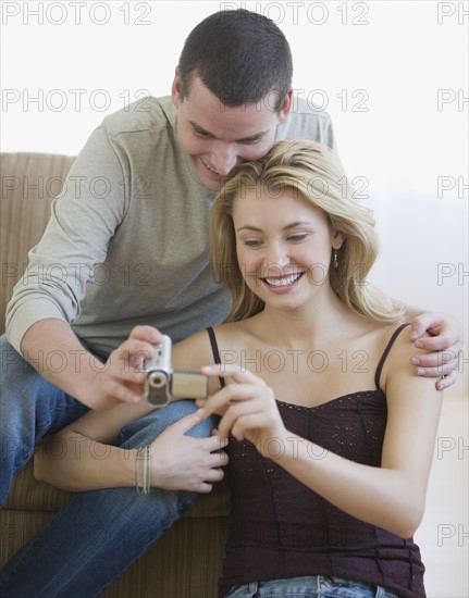 Couple looking at video camera.