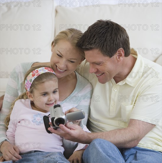 Family looking at video camera.