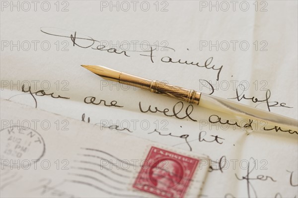 Quill pen on old letter.