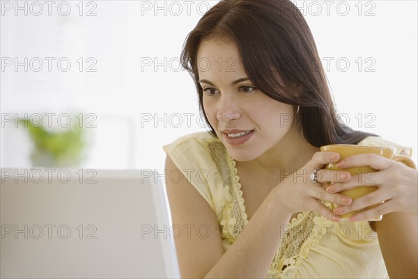 Woman looking at computer.