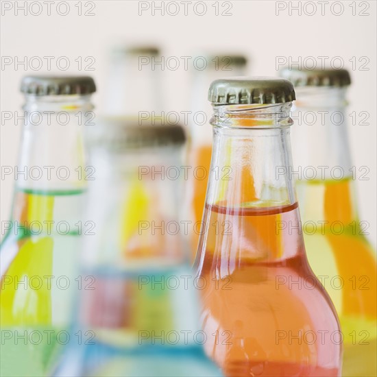 Close up of glass soda bottles.
