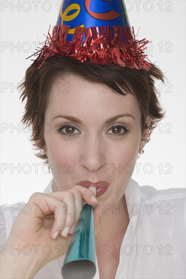 Woman wearing party hat.