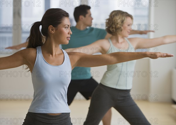 Multi-ethnic people in yoga class.