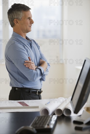 Businessman with arms crossed.