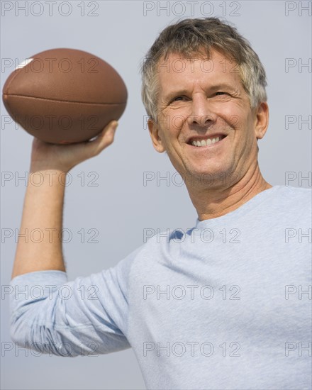 Man throwing football.
