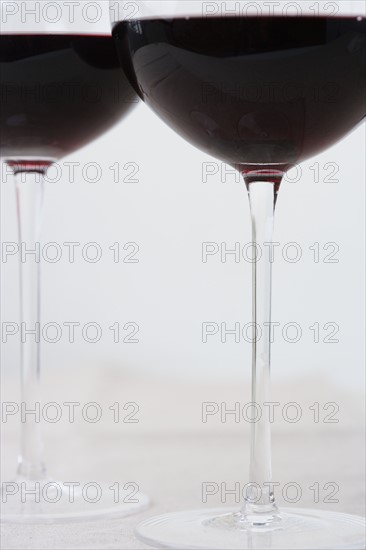 Bottom of wineglasses with red wine. Date : 2006