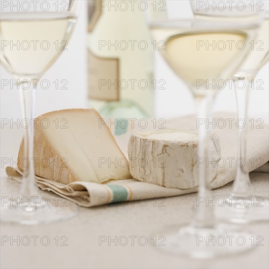 Glasses of white wine with cheese. Date : 2006