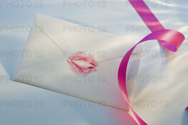 Envelope with lipstick kiss.