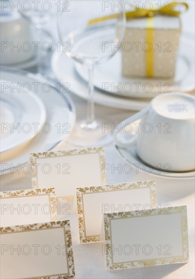 Blank cards next to dishes on table.