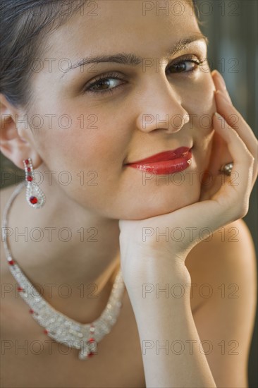 Woman wearing expensive matching jewelry.