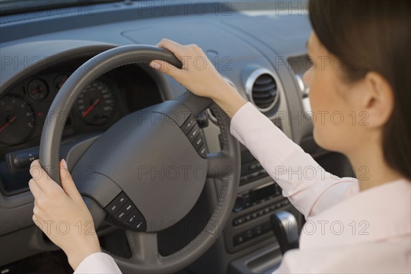 Woman driving car.