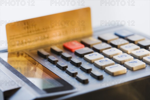 Close up of credit card machine and credit card.