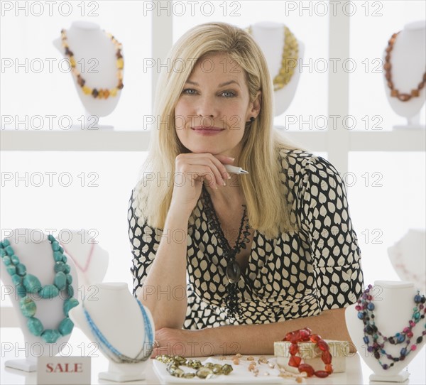 Woman working in jewelry store.